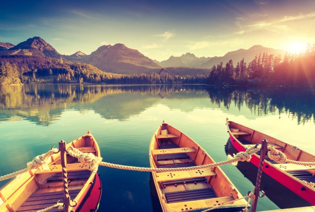 Fantastic mountain lake in National Park High Tatra. Dramatic scenery. Strbske pleso, Slovakia, Europe. Beauty world. Retro style filter. Instagram toning effect.